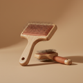Natural oak pin brush featuring a terracotta-toned silicone base from the "Daily Grooming Essentials" collection:...