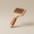 Wooden slicker brush with a terracotta rubber grip from the "Daily Grooming Essentials" collection: Ergonomic tools...